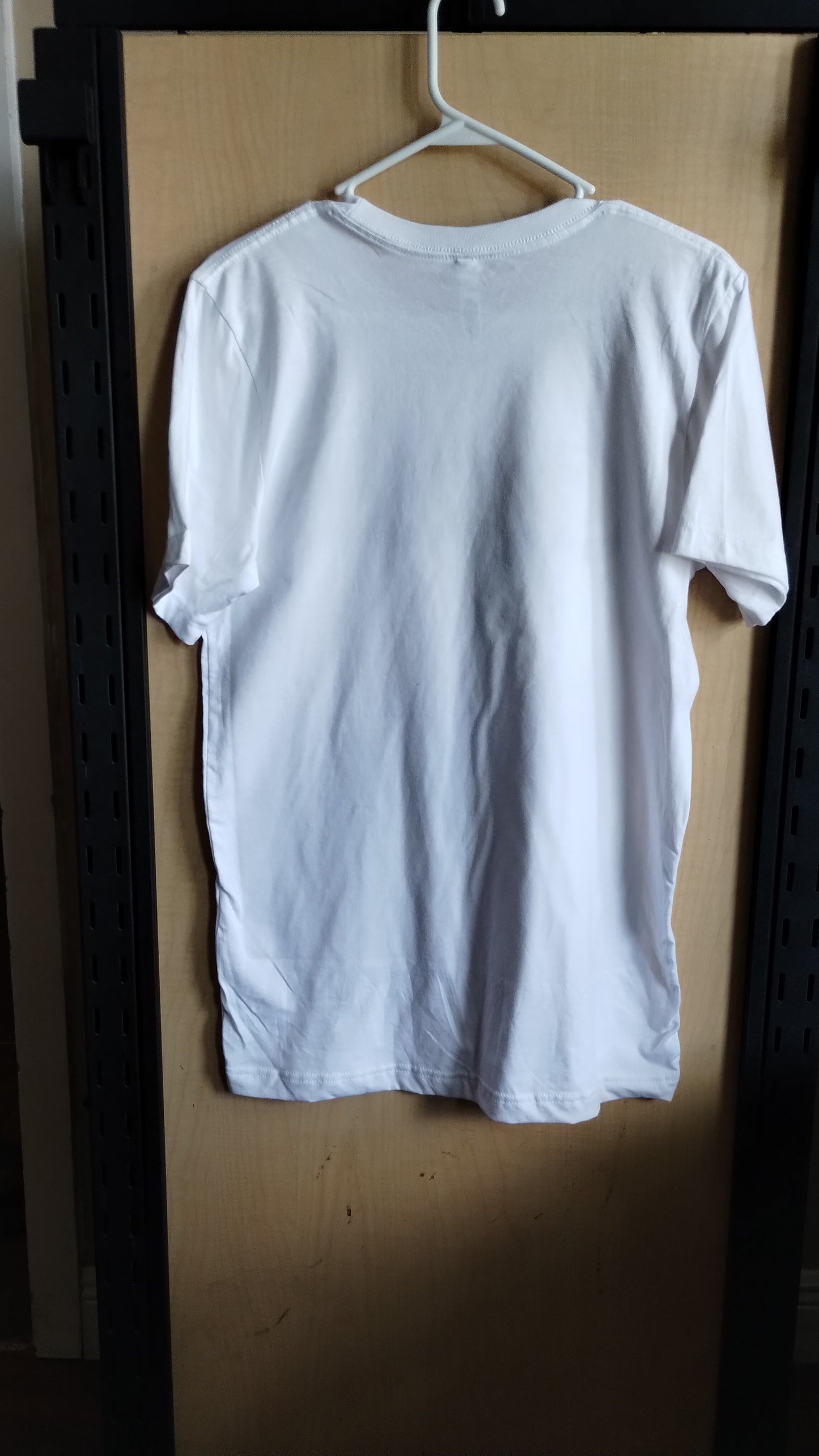 Back view of White Tshirt on a hanger.