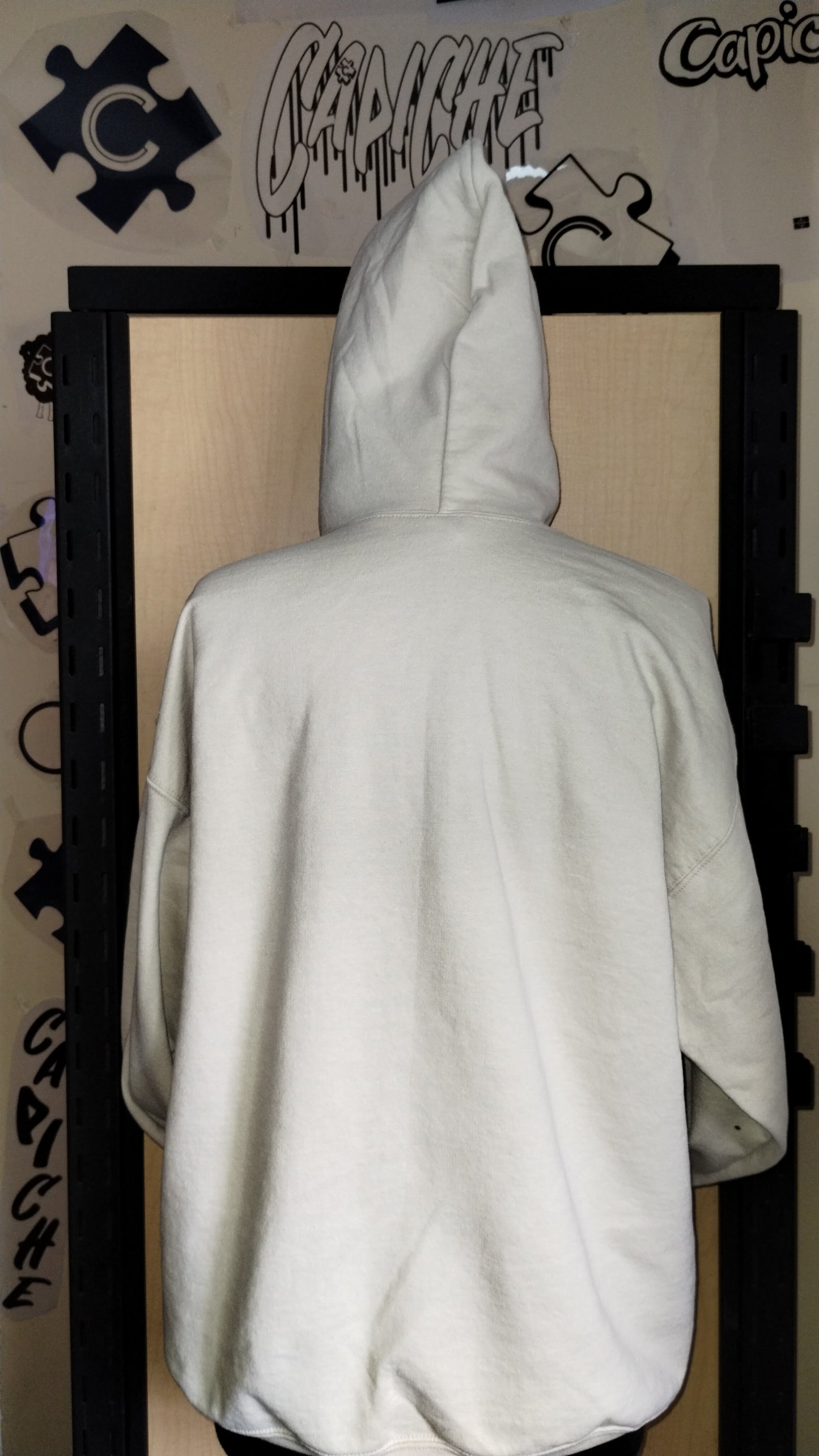 Back view of tan hoodie on manikin