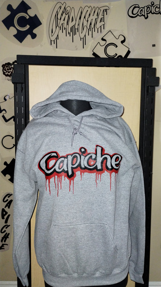 Front view of grey hoodie on a manikin. Capiche logo in black and red ink.