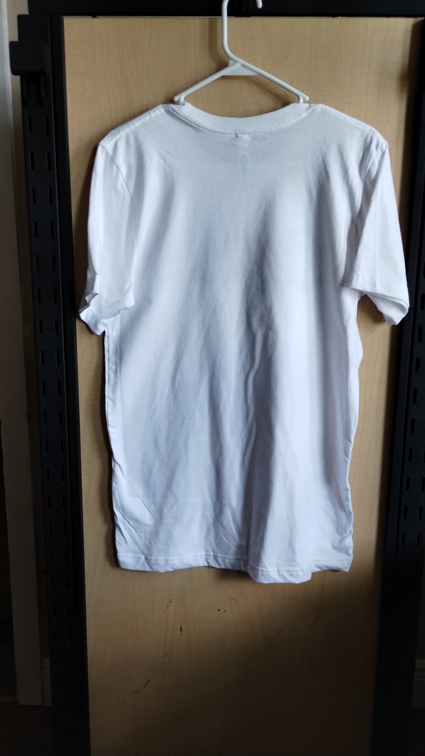 Back view of White Tshirt on a hanger. 